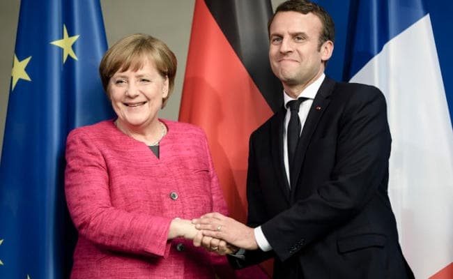 मैक्रों, मर्केल ने यूक्रेन में पूर्ण संघर्ष विराम लागू करने पर दिया जोर