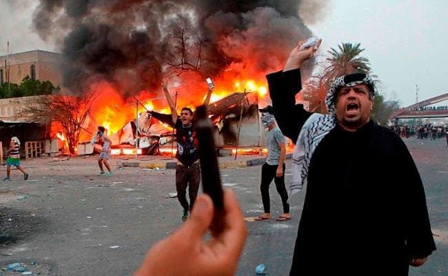 IN PICS : प्रदर्शनकारियों पर सुरक्षा बलों ने इराक में चलायी गोली, एक की मौत