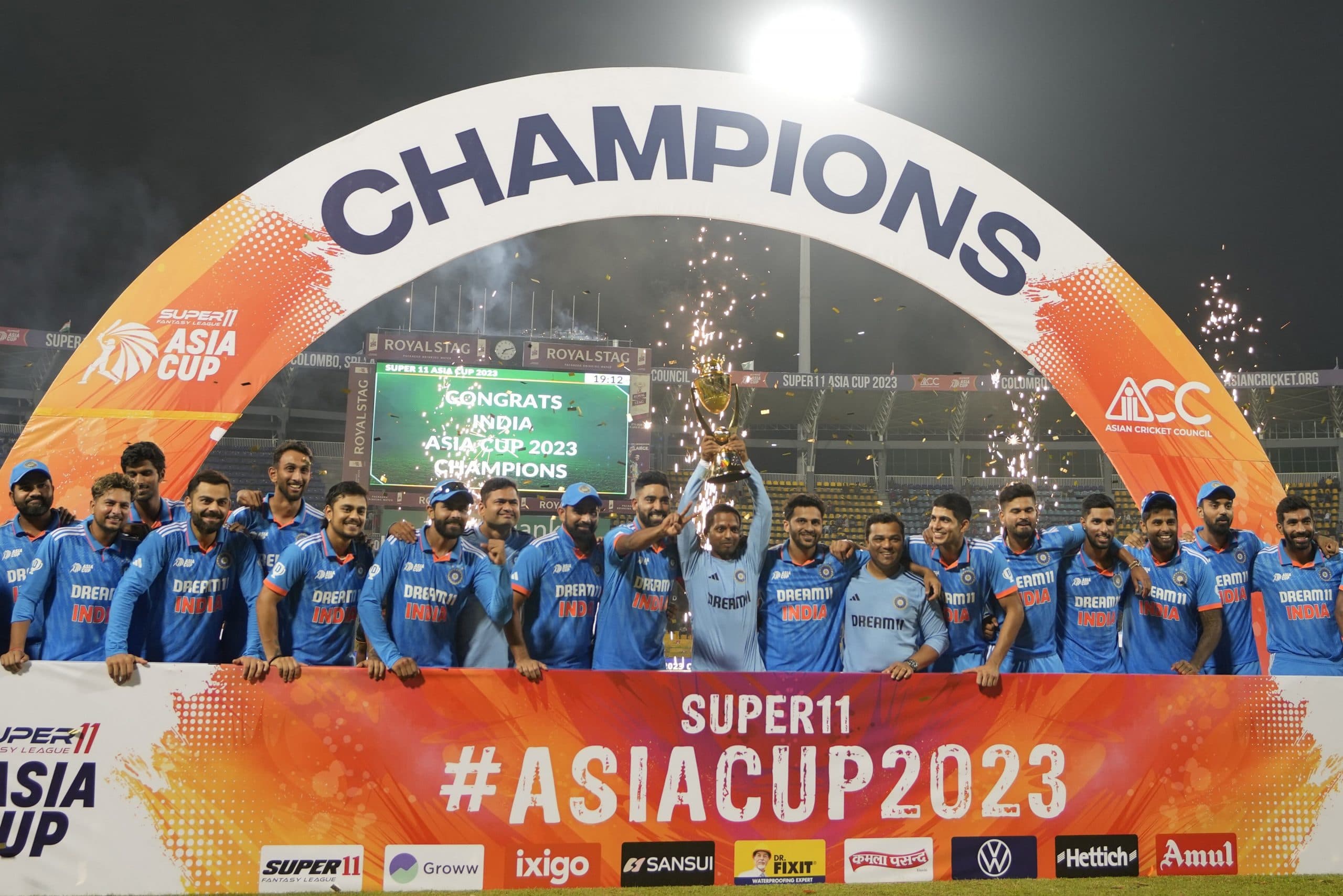 Indian players celebrate with the trophy after their win in the Asia Cup cricket final against Sri Lanka, in Colombo, Sri Lanka,
