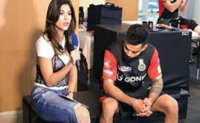 महिला एंकर की फटी जींस को ताकते कैमरे में कैद हुए विराट कोहली, तसवीर वायरल