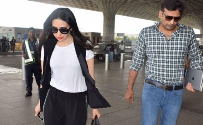 PHOTO: एयरपोर्ट पर ब्‍वॉयफ्रेंड संग दिखीं करिश्‍मा कपूर!