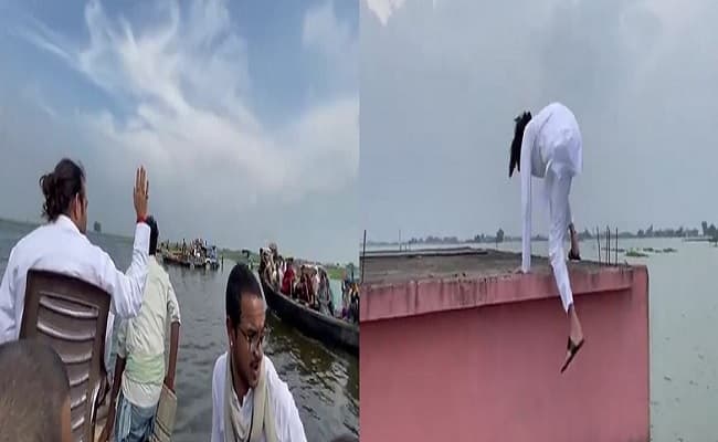 VIDEO: नाव पर कुर्सी लगा अपने अंदाज में बाढ़ पीडितों के बीच पहुंचे तेज प्रताप, लालू से करायी लोगों की बात