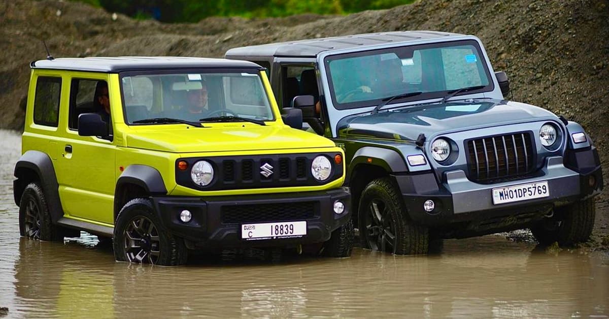 Mahindra Thar vs Maruti Jimny: ग्राउंड क्लीयरेंस और फ्यूल कैपेसिटी में कौन है बेहतर?