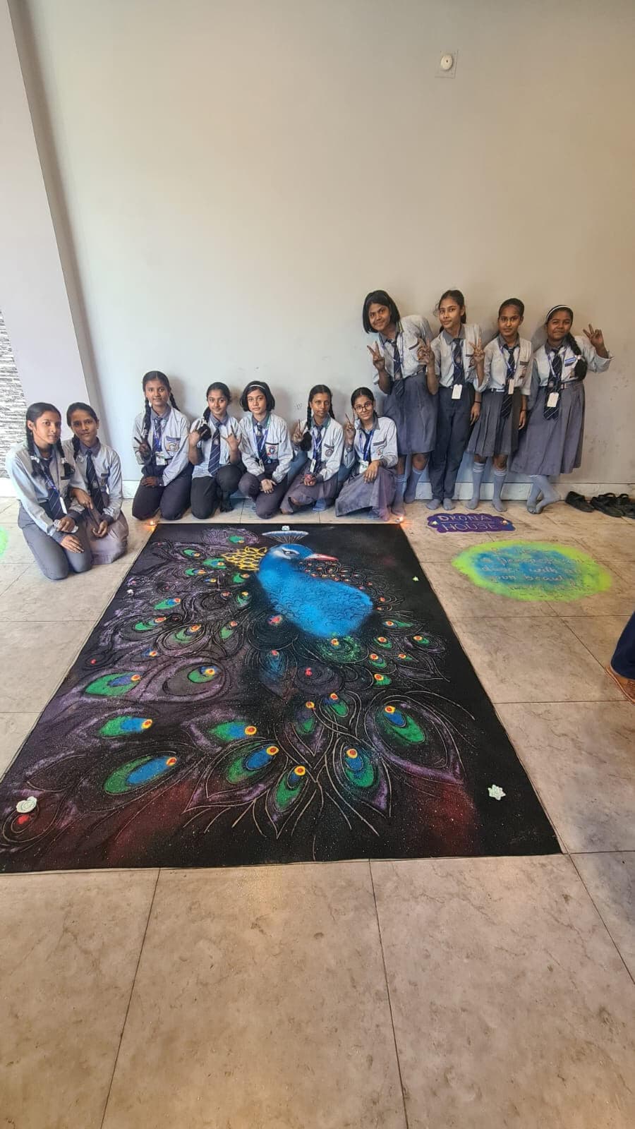 रंगोली प्रतियोगिता में द्रोण हाउस रहा प्रथम