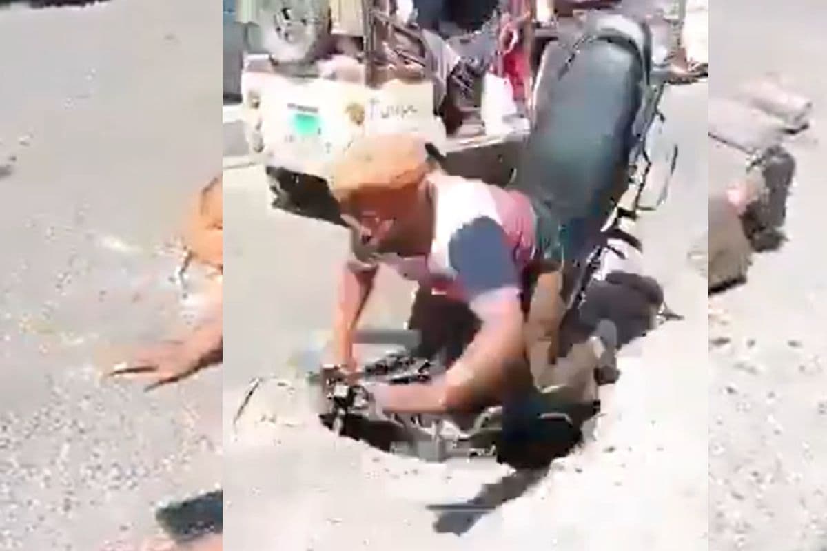 Viral Video: बाइक समेत मैन होल में समा गया शख्स, कार के पीछे चलना पड़ गया महंगा, वायरल हो रहा वीडियो