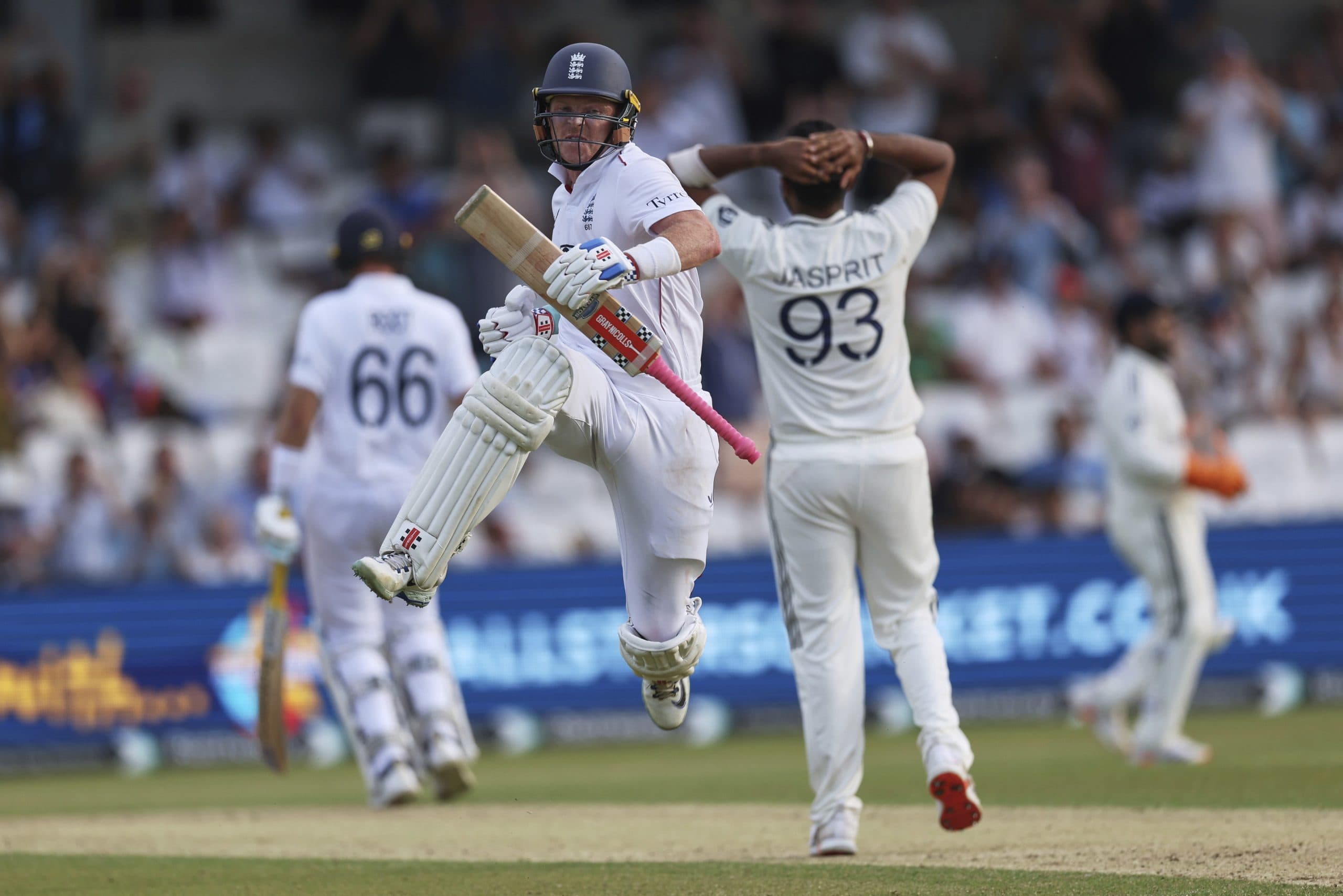 Ollie Pope celebrates after scoring a century.