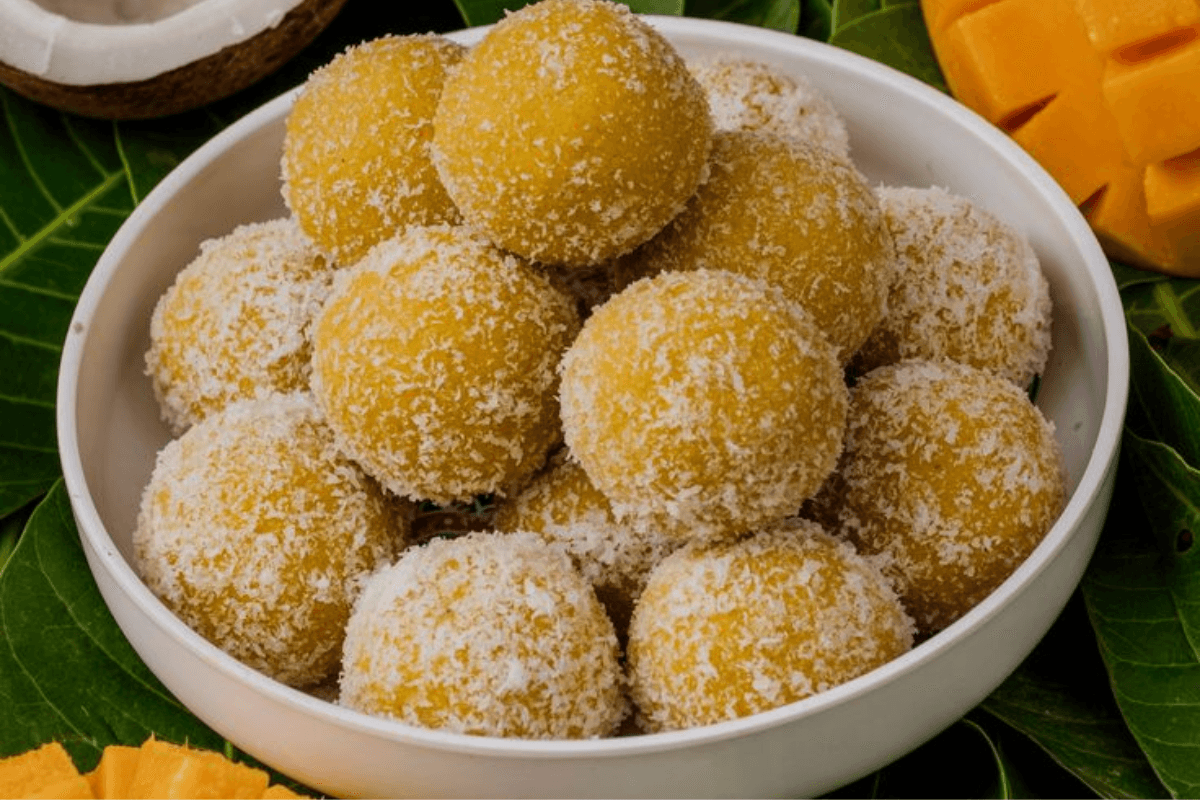 Mango Coconut Ladoo Recipe: आम और नारियल से बनाएं ये झटपट स्वादिष्ट मिठाई | मैंगो कोकोनट लड्डू रेसिपी Mango Coconut Ladoo Recipe: आम और नारियल से बनाएं ये झटपट स्वादिष्ट मिठाई | मैंगो कोकोनट लड्डू रेसिपी