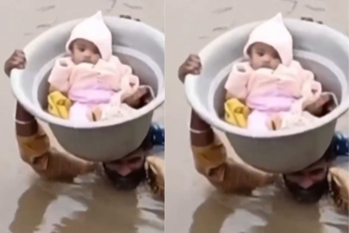 Viral Video: गले तक पानी, सिर पर बच्चा, बेटी की जान बचाने के लिए डूबते रहे पिता, वीडियो देखकर आ जाएगा रोना