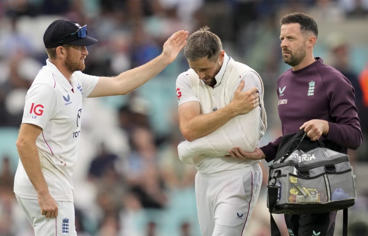 England's Chris Woakes walks off the field after his left shoulder got injured