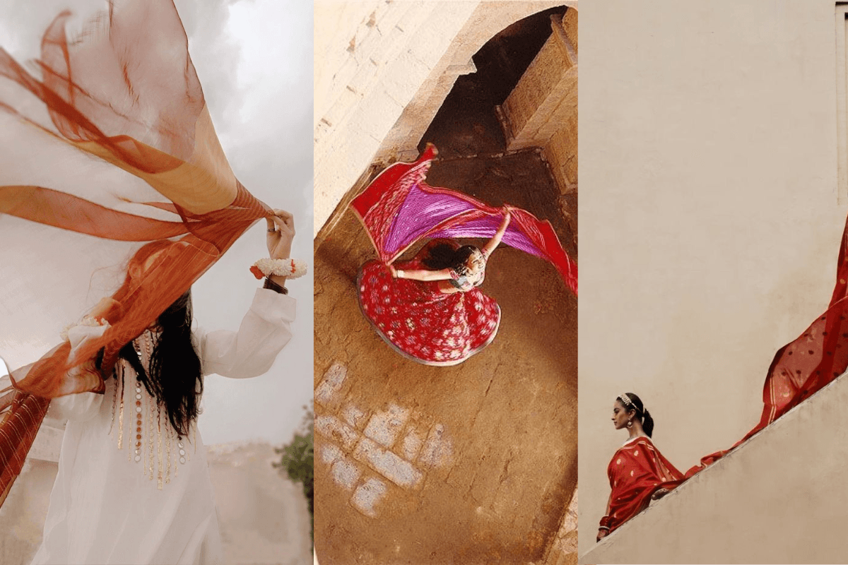 Indian woman with flying dupatta doing Teej photography photoshoot.