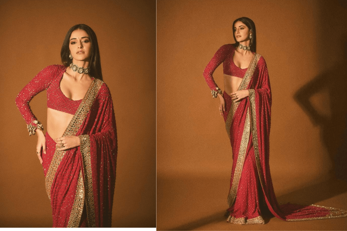 Beautiful woman in saree doing open pallu flow pose for Teej photography photoshoot.