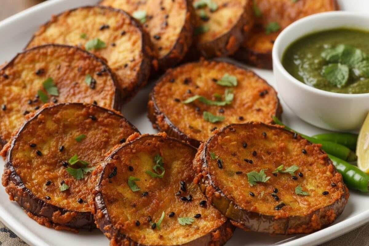 Baingan Bhaja Recipe: बस कुछ ही मिनटों में तैयार करें टेस्टी बैंगन भाजा, लंच या डिनर दोनों के लिए है बेस्ट 