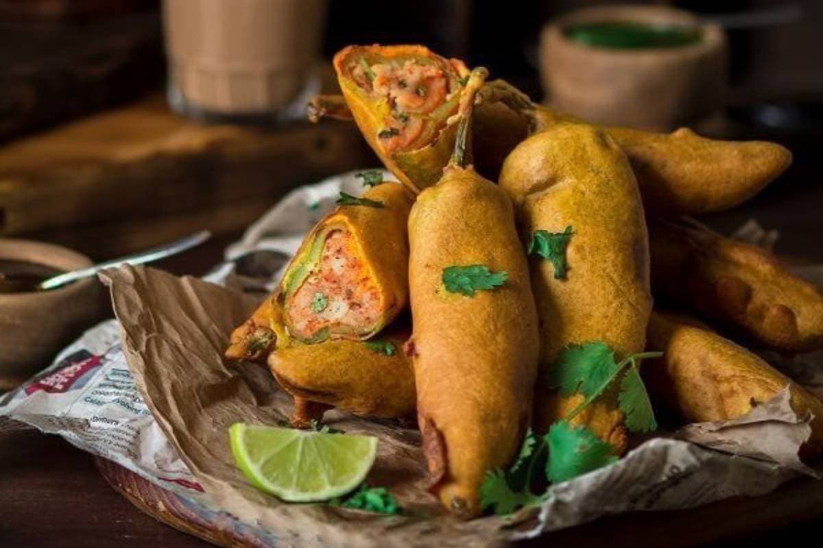 Rajasthani Mirchi Vada Recipe: नाश्ते में बनाएं राजस्थानी मिर्ची वड़ा, कुरकुरा और चटपटा स्वाद के लिए नोट करें ये रेसिपी Rajasthani Mirchi Vada Recipe: नाश्ते में बनाएं राजस्थानी मिर्ची वड़ा, कुरकुरा और चटपटा स्वाद के लिए नोट करें ये रेसिपी