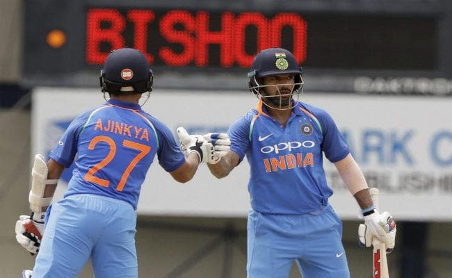 बारिश के कारण मैच बाधित, धवन व रहाणे की अर्धशतकीय पारी