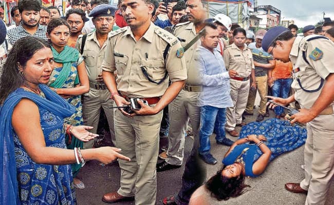 ...जब ट्रैफिक पुलिस ने स्कॉर्पियो में लगी काली फिल्म हटायी, काटा चालान, बीच सड़क पर लेट गयी महिला, किया हंगामा, लगा जाम