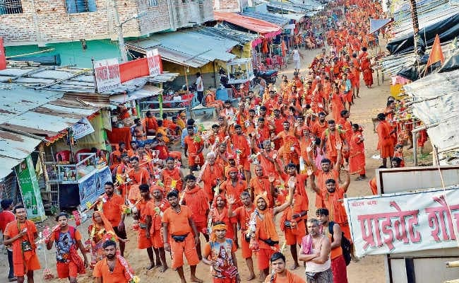देवघर : सावन की पहली सोमवारी , कांवरिया पथ पर उमड़ा कांवरियों का सैलाब