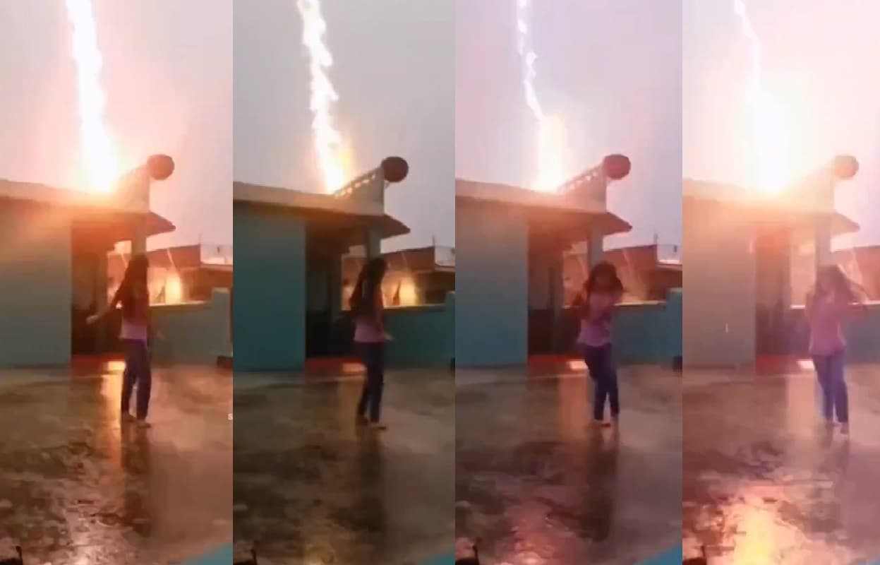 Viral Video: рдмрд╛рд░рд┐рд╢ рдореЗрдВ рд░реАрд▓ рдмрдирд╛ рд░рд╣реА рдереА рд▓рдбрд╝рдХреА, рддрднреА рдЖрд╕рдорд╛рди рд╕реЗ рдЧрд┐рд░реА рдмрд┐рдЬрд▓реА, рдмрд╛рд▓-рдмрд╛рд▓ рдмрдЪреА рдЬрд╛рди