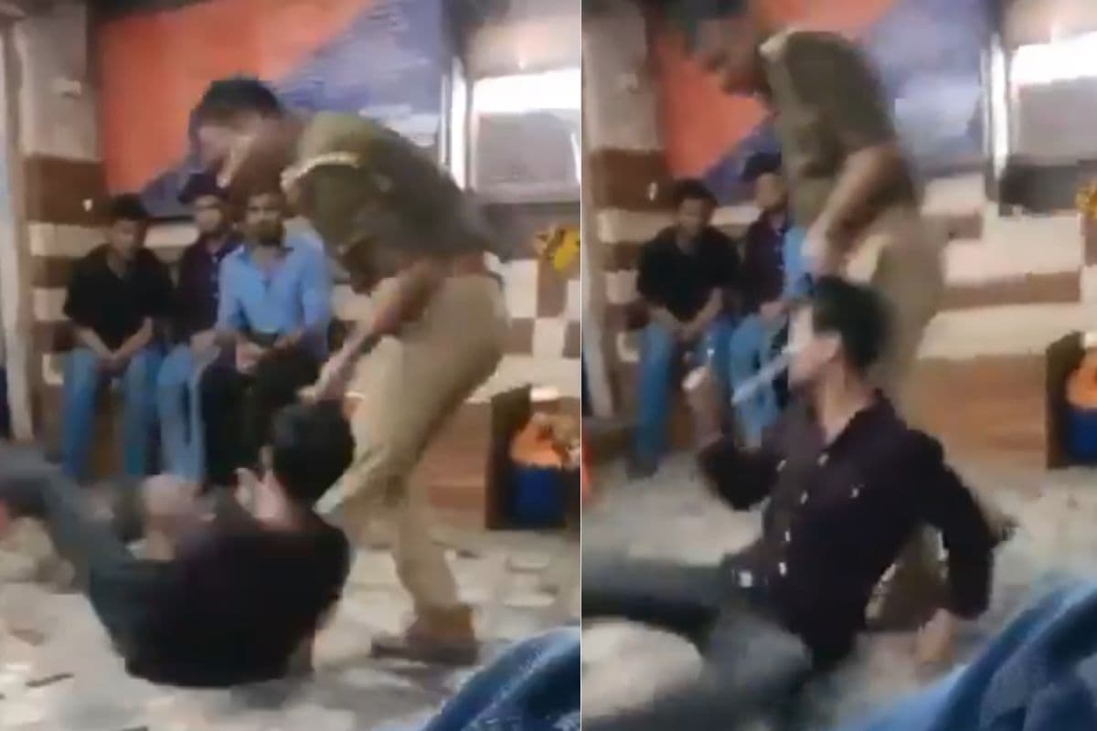 Viral video of police inspector brutally beat student in varanasi Viral video of police inspector brutally beat student in varanasi