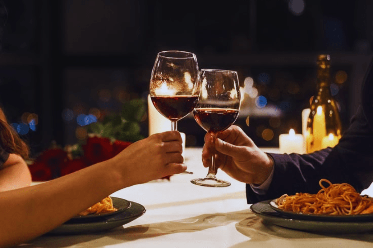 National Wine Day 2025 | People celebrating National Wine Day 2025 with wine glasses