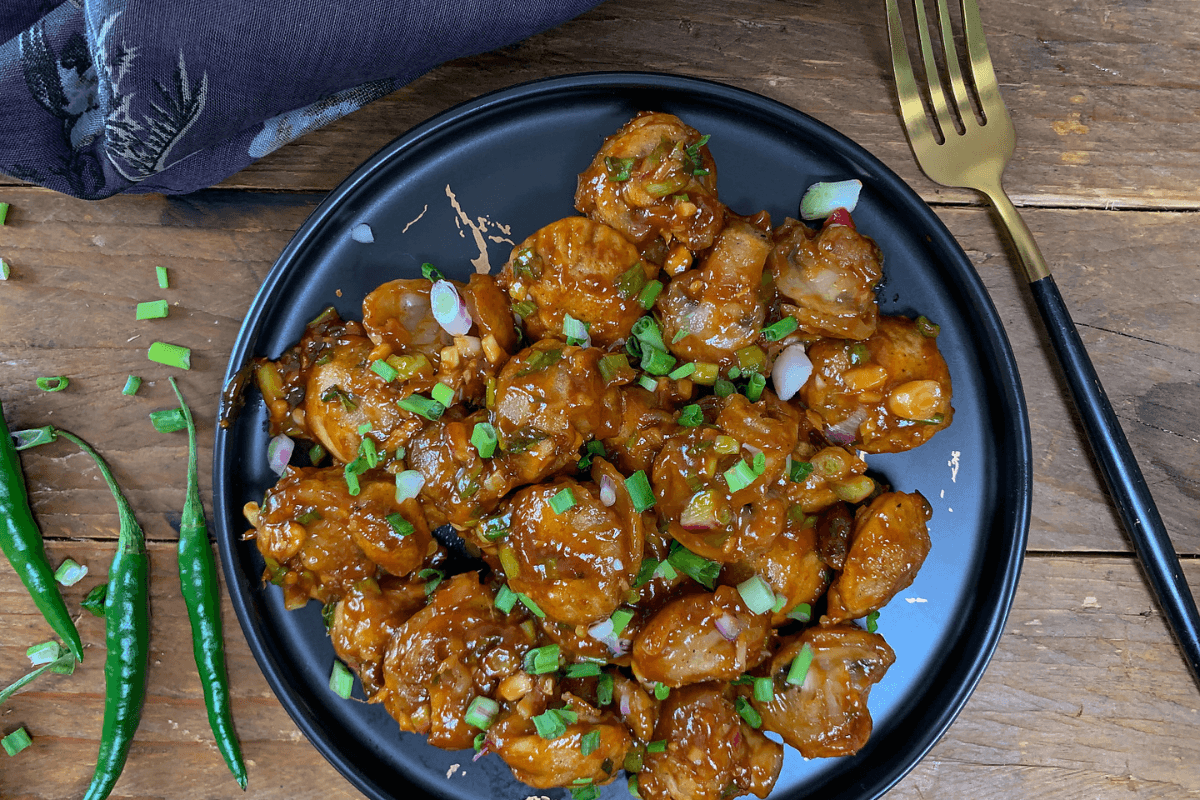 Mushroom Manchurian Recipe: घर पर बनाएं मसालेदार मशरूम मंचूरियन, झटपट और टेस्टी Mushroom Manchurian Recipe: घर पर बनाएं मसालेदार मशरूम मंचूरियन, झटपट और टेस्टी