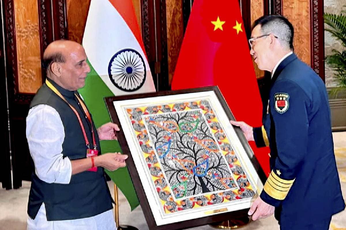 Defence Minister Rajnath Singh presents a Madhubani art painting