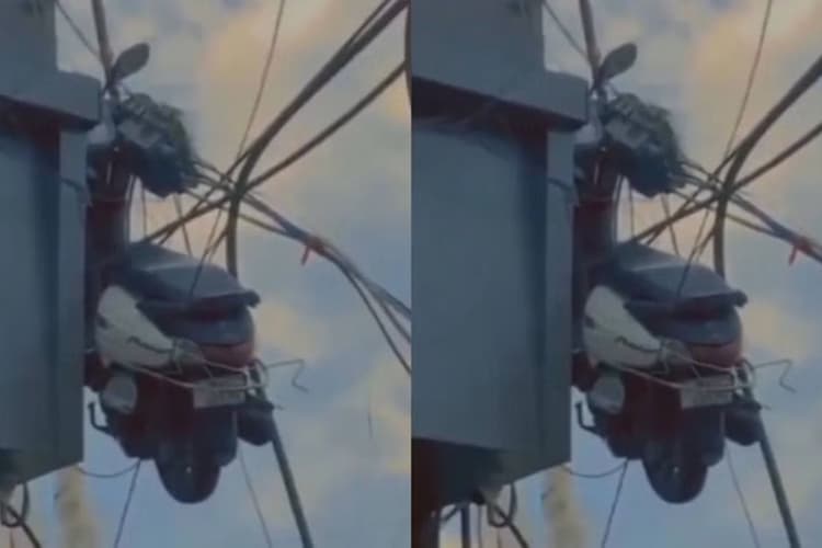बिल्डिंग पर लटकती स्कूटी का वीडियो हुआ वायरल, लोग बोले- 'ये काम तो किसी पापा की परी का ही लग रहा है'