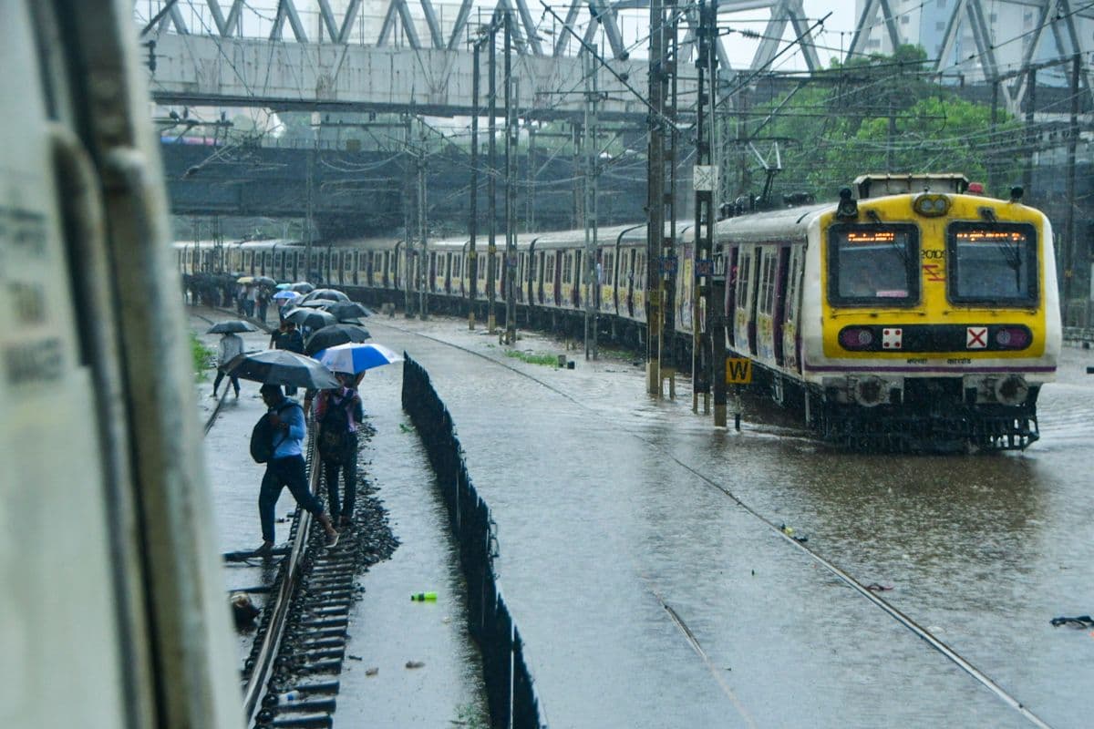 train-passes-through-waterlogged-railway-tracks