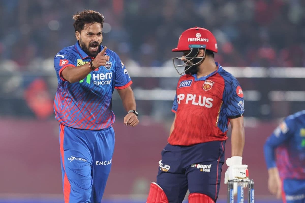 Mukesh Kumar celebrating after taking a wicket.