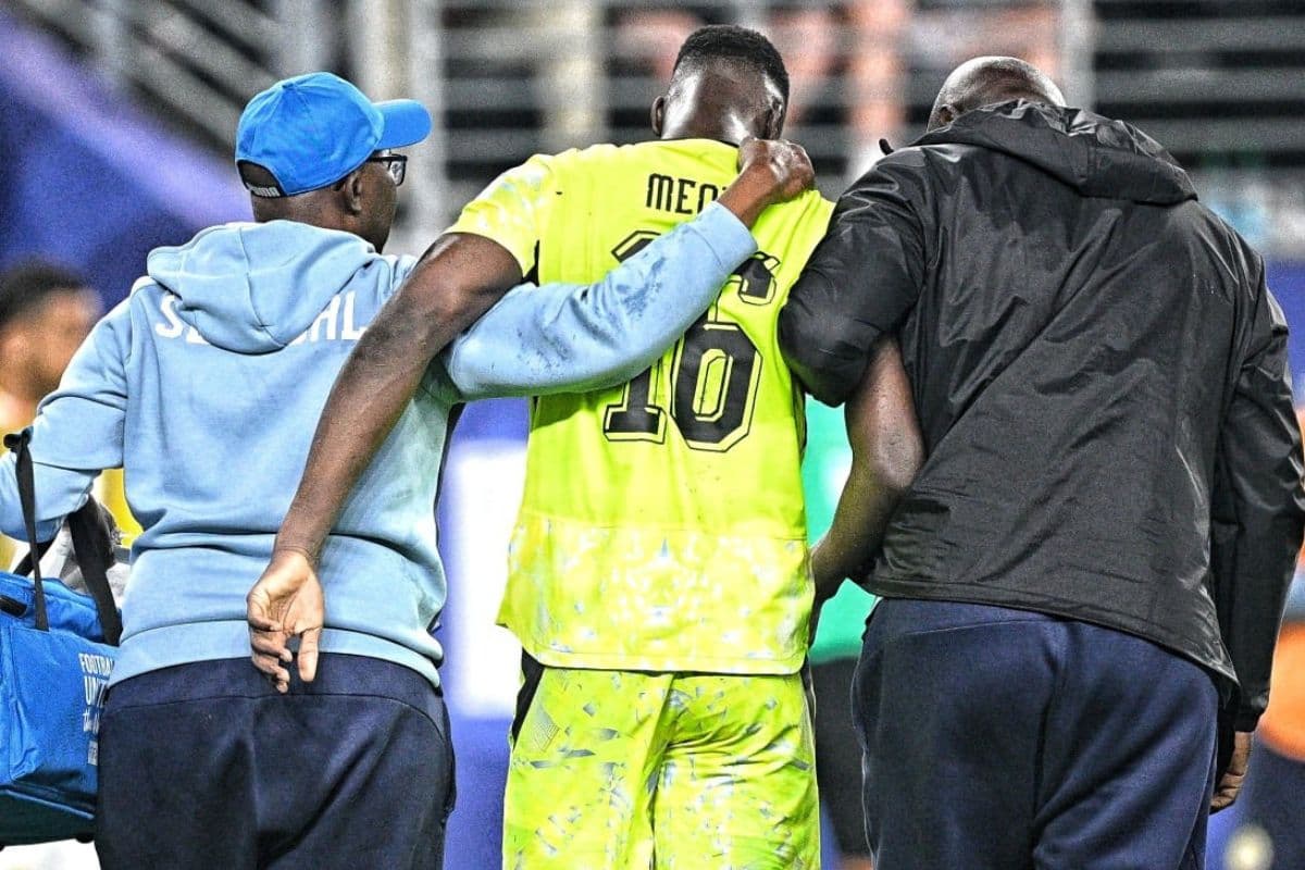 Medical staff escorting goalkeeper Edouard Mendy off the field. Medical staff escorting goalkeeper Edouard Mendy off the field.