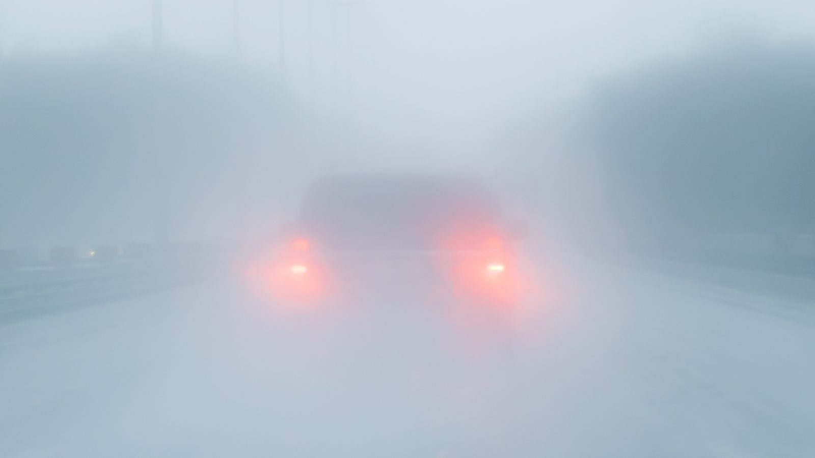Car Driving In Foggy Weather